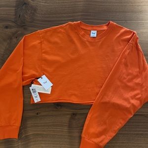 BNWT TNA laidback cropped long sleeves. COLOUR MANDARIN ORANGE